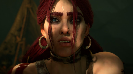 A red-haired, female Spiritborn looks ahead with a wary look on her face.