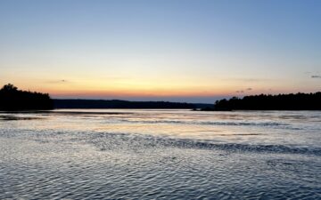 Summer sunset over water in Maine.